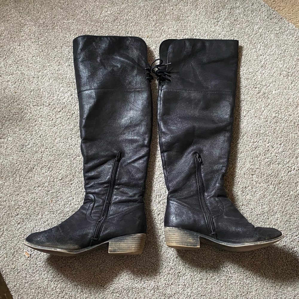 Black knee-high riding boots